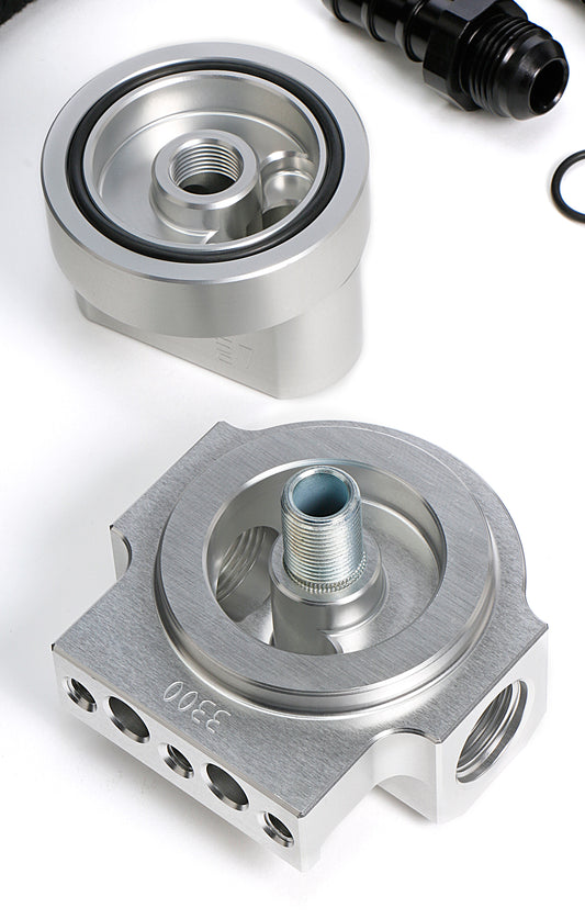 HAMBURGER'S PERFORMANCE PRODUCTS BILLET ALUMINUM SINGLE OIL FILTER RELOCATION KIT; HORIZONTAL PORT; 2-1/2 IN. I.D. 2-3/4 IN. O.D. OIL FILTER FLANGE; 3/4 IN.-16 NIPPLE- FORD & MOPAR 3353