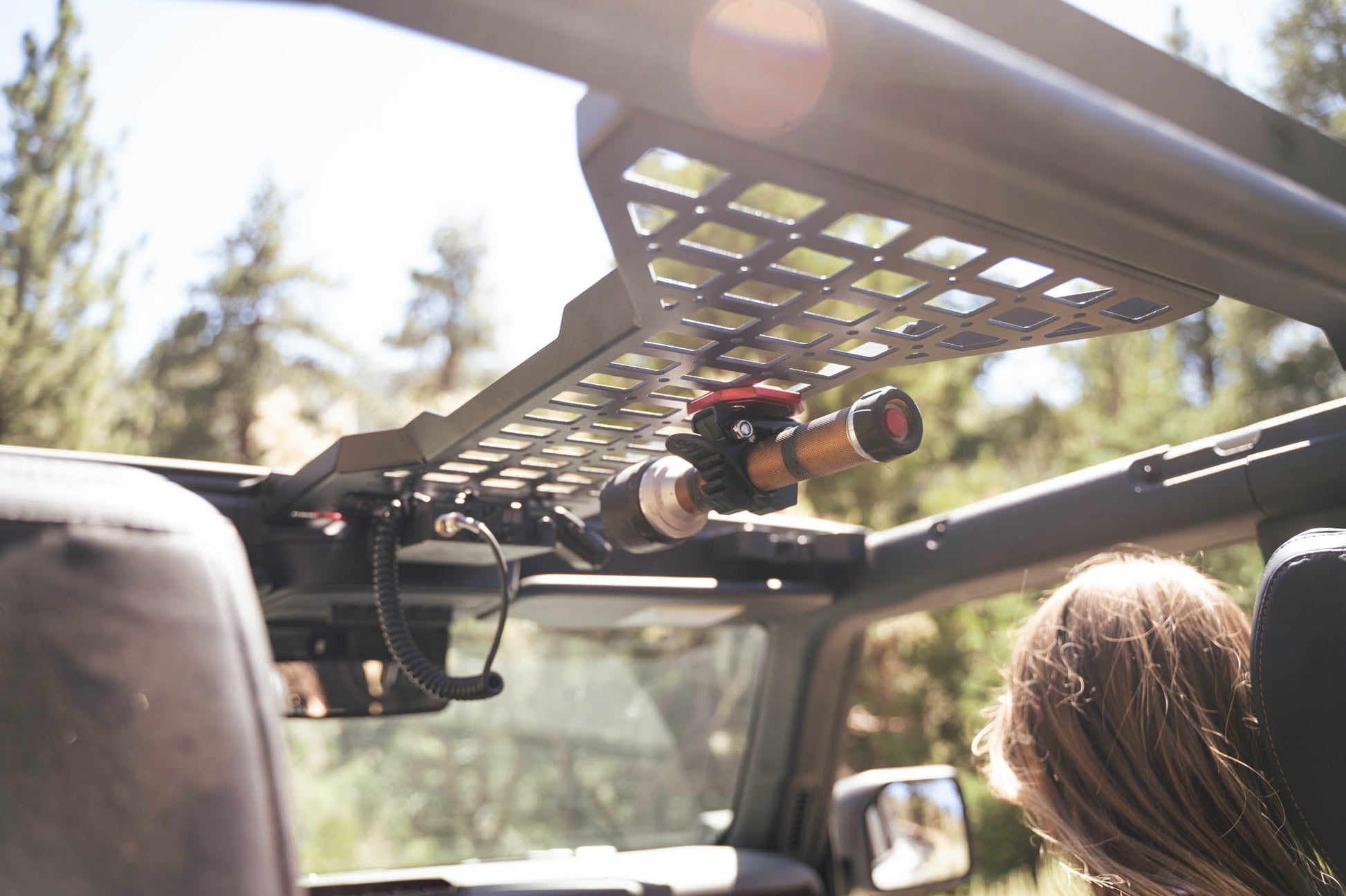 Flashlight mounted to the Overhead Molle Panel for the 2021-2023 Ford Bronco